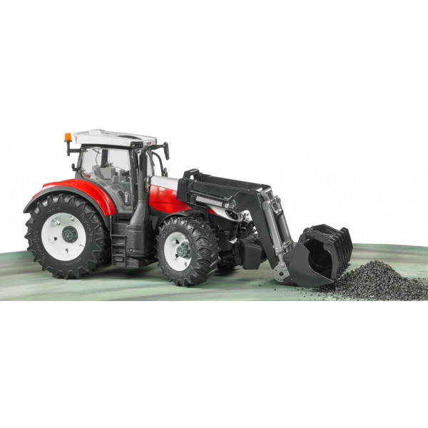 Фото - Наземная строительная техника BRUDER Трактор Steyr 6300 Terrus с погрузчиком красно-белый, М1:16