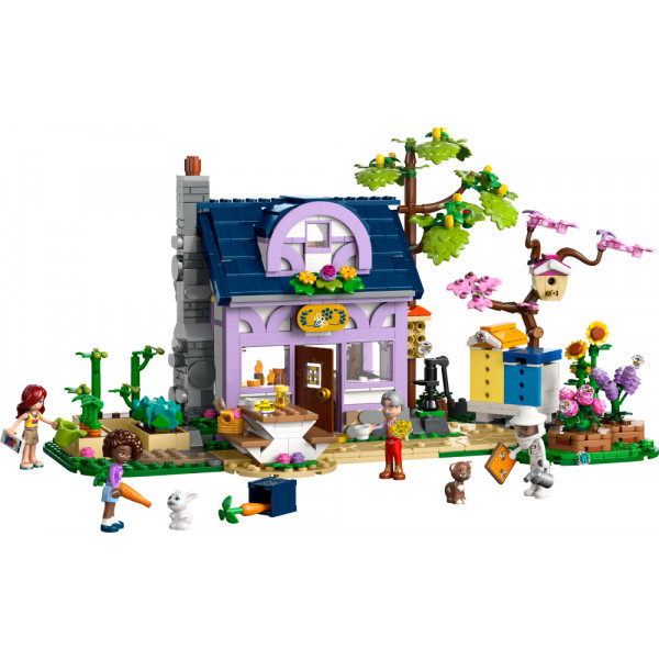 Фото - Конструктор LEGO Friends Будиночок і квітник бджолярів (42669)