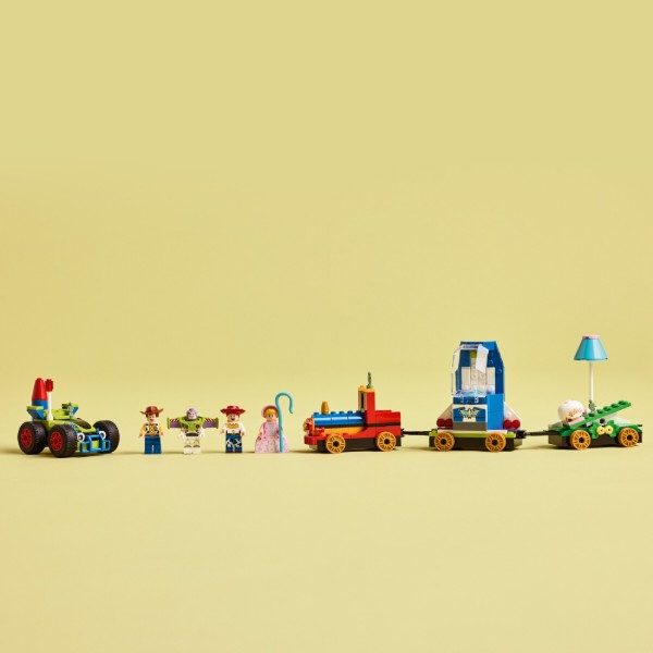 Фото - Конструктор LEGO Disney Pixar Святкування з Історії Іграшок: потяг і авто для перегонів (43264)